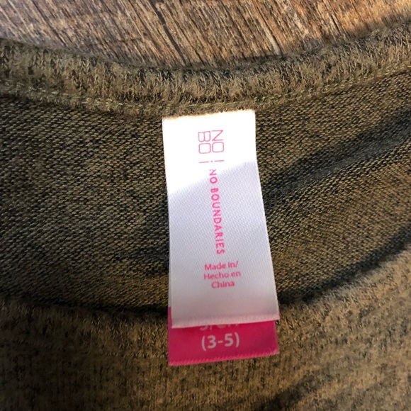 Green top with ruffle on chest size small. - Picture 3 of 3